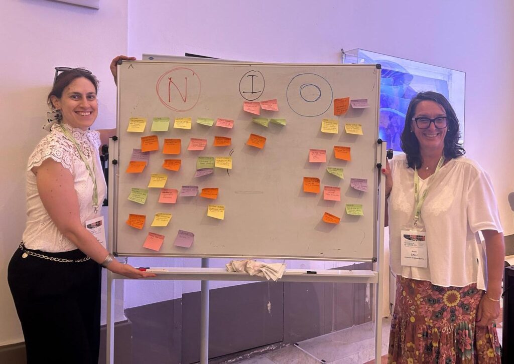 Prof. GAlli e and E.Ponzini with the topic board